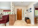 Inviting entryway featuring a brick accent wall and a view into the living area at 839 Montford Dr, Charlotte, NC 28209