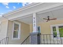 Close-up of the front porch showing the house number and a ceiling fan at 933 Old Charlotte Rd, Concord, NC 28027