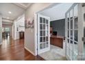 Stylish home office with French doors, modern desk, and plenty of natural light at 1012 Kings Bottom Dr, Fort Mill, SC 29715