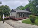 Charming one-story home featuring a spacious porch, neutral siding, and well-maintained landscaping at 103A N Tracy St, Kings Mountain, NC 28086