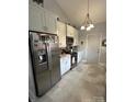 Modern kitchen features stainless steel appliances, including a refrigerator and range, with stylish tiled flooring at 111 Brookview Dr, Shelby, NC 28152