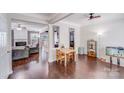 Spacious open-concept living and dining area with hardwood floors and natural light at 11714 Harsworth Ln, Charlotte, NC 28277