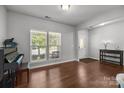 Open living area with hardwood floors, large window, and a view of the front door and entryway at 1300 Yellow Springs Dr, Indian Land, SC 29707