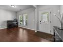 Bright entryway featuring hardwood floors, neutral walls, and natural light from the front door and window at 1300 Yellow Springs Dr, Indian Land, SC 29707