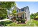 A beautiful home with a lush green lawn and well-maintained landscaping, providing great curb appeal at 1300 Yellow Springs Dr, Indian Land, SC 29707