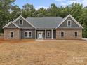 Charming single-story home featuring an inviting stone and siding exterior at 209 Stafford Estates Dr, Salisbury, NC 28146