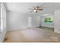 Open living room area with natural light and neutral carpet at 2223 Pacer Rd, Lancaster, SC 29720