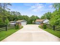 Charming home with long driveway, lush lawn, and stone accents near trees, offering curb appeal and privacy at 2949 Anderson Burgess Rd, Sharon, SC 29742