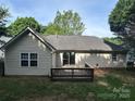 Home's rear exterior with deck and siding, showcasing a private backyard space at 3124 Burkston Rd, Charlotte, NC 28269