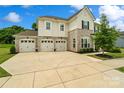 Beautiful home with a stone facade, three-car garage, and a large driveway perfect for Gathering living at 433 Sinaloa St, Waxhaw, NC 28173
