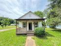 Cozy home with a welcoming covered porch and a clear view of the front entrance at 502 E Main St, Cleveland, NC 27013