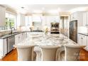 Spacious kitchen with a large island, stainless steel appliances, and modern finishes at 5046 Cressingham Dr, Fort Mill, SC 29707