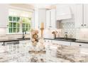 Granite countertops and stainless steel appliances enhance the modern kitchen design and decor at 5046 Cressingham Dr, Fort Mill, SC 29707