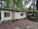 Shows exterior features and weathered facade including a small porch and stairs at 509 Waring Ct # Lot 4, Fort Mill, SC 29707