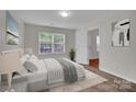 Cozy bedroom with a large window, soft natural light, and neutral decor at 5237 Ficus Tree Ln, Charlotte, NC 28215