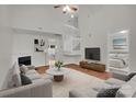 Bright living room with high ceilings, fireplace, and contemporary furnishings at 5237 Ficus Tree Ln, Charlotte, NC 28215