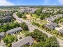 Expansive aerial view showcasing the community, lush greenery, and convenient access to local amenities at 5305 Waverly Lynn Ln # 4A, Charlotte, NC 28269