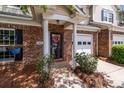 Welcoming front entrance with brick accents, a charming wreath, and a well-maintained facade at 5305 Waverly Lynn Ln # 4A, Charlotte, NC 28269