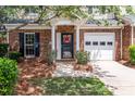 Inviting front door with a decorative wreath, brick accents, and a well-maintained entrance at 5305 Waverly Lynn Ln # 4A, Charlotte, NC 28269