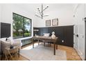 Bright and airy home office featuring stylish decor and a large window at 550 W Cama St, Charlotte, NC 28217