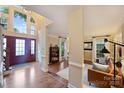 Grand foyer with hardwood floors, a soaring arched window above the front door, and inviting living spaces at 6722 Elmstone Dr, Charlotte, NC 28277
