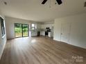Spacious living room featuring bright natural light, and a view of the backyard at 760 3Rd Street Sw Pl, Hickory, NC 28602