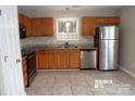 Kitchen with stainless appliances, granite countertops, tile backsplash and tile floors at 8432 Spirea Ct, Charlotte, NC 28215