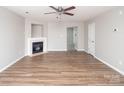 Spacious living room with wood floors, a fireplace, and neutral paint at 8432 Spirea Ct, Charlotte, NC 28215
