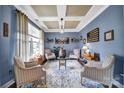 Comfortable formal living room with large windows, tray ceilings, and stylish decor at 998 Emory Ln, Fort Mill, SC 29708