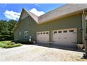 Spacious two-car garage with carriage doors, offering ample parking and storage at 114 Wingard Rd, Concord, NC 28025
