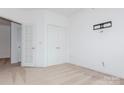 Neutral bedroom with carpet, closet and double doors leading out at 11863 Ridgeway Park Dr, Charlotte, NC 28277