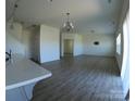 Open-concept living room with hard surface floors and ample natural light at 120 Mooring Dr, Statesville, NC 28677
