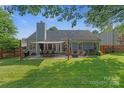 Spacious backyard with a patio area, perfect for outdoor dining and entertaining at 1310 Bellhook Nw Pl, Concord, NC 28027