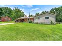 Lovely single-story home boasting a lush green lawn and charming exterior details at 141 Porter Rd, Statesville, NC 28625