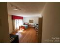 Inviting room with hardwood floors, large bright windows, and neutral walls, ready for your personal touch at 170 Heritage Ln, Salisbury, NC 28147