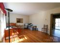 Bright room with hardwood floors, large window, and neutral walls, ready for your personal touch at 170 Heritage Ln, Salisbury, NC 28147