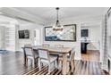 Spacious dining room features dark hardwood floors, stylish furniture, and a modern light fixture at 2005 Schofield Pl, Salisbury, NC 28144