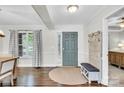 Inviting foyer with wood floors, a storage bench, and a view of the dining area at 2005 Schofield Pl, Salisbury, NC 28144