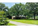 Spacious, well-maintained home with a lush green lawn and mature trees providing ample shade at 2618 Pineview Dr, Lancaster, SC 29720