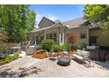 Outdoor patio with a hot tub, chairs, and a fire pit, perfect for entertaining guests at 3009 Botetourt Ct, Weddington, NC 28104