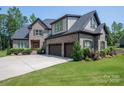 Beautiful brick home boasts an attached garage and well-maintained landscaping for enhanced curb appeal at 4143 Willow Haven Dr, Denver, NC 28037