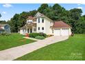 Charming two-story home with an attached two-car garage and spacious front yard at 4499 Briarcreek Rd, Maiden, NC 28650