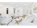 Inviting living room showcasing modern decor, neutral tones, comfortable seating, and plenty of natural light at 4905 Chestnut Lake Dr, Charlotte, NC 28227