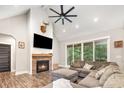 Inviting living room featuring a brick fireplace, shiplap accent wall, and sliding doors to the patio at 5215 Star Magnolia Ct, Clover, SC 29710