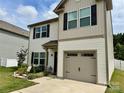 Lovely two-story home featuring black shutters, and an attached one car garage at 750 Fraternity Row, Kannapolis, NC 28081