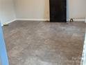 Finished basement area with durable flooring, perfect for recreation or storage at 936 New Camp Creek Church Rd # 11, Kings Mountain, NC 28086
