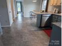 Open kitchen area boasts ample space, modern appliances, and neutral tones that blend seamlessly with the adjacent dining area at 936 New Camp Creek Church Rd # 11, Kings Mountain, NC 28086
