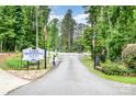 Welcoming entrance to Lake Montonia Club, Inc. with established landscaping and clear signage at 1102 Lake Montonia Rd, Kings Mountain, NC 28086