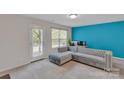The spacious living room with a comfortable sofa at 117 Langhorne Dr, Mount Holly, NC 28120
