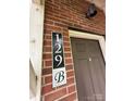 Close-up of a front door with house number 129B at 129 Steinbeck Way, Mooresville, NC 28117